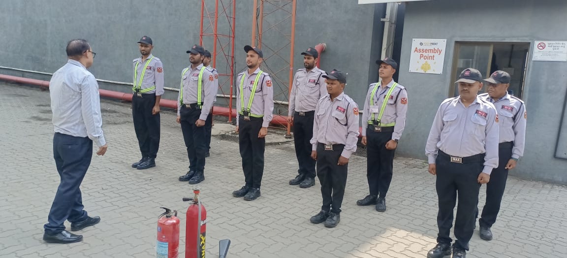 Fire safety drill with Max Vigil guards and extinguishers